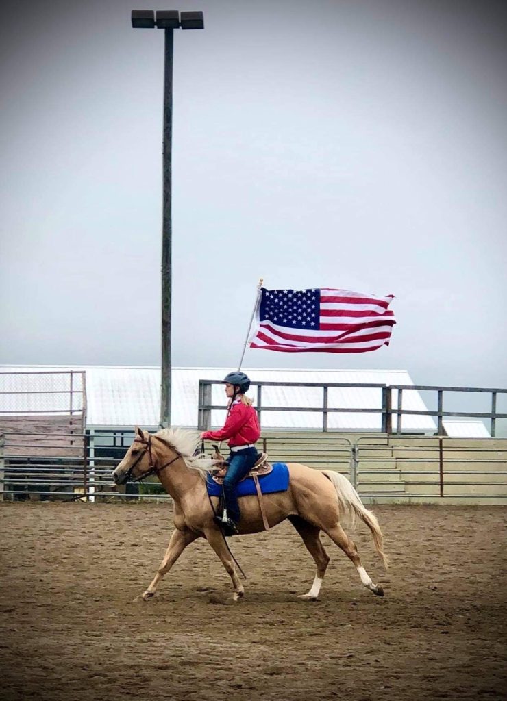 Horse show rider with American Flag
